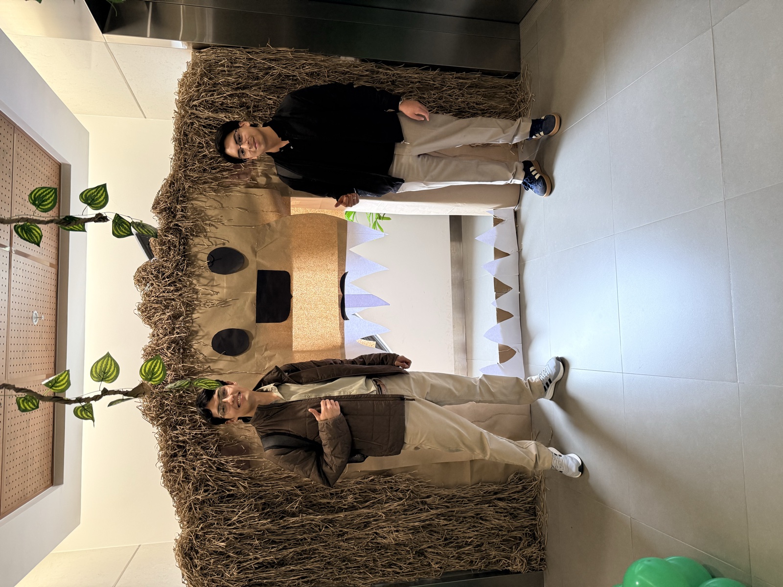 Colleagues beside a decorated doorway at Interbank